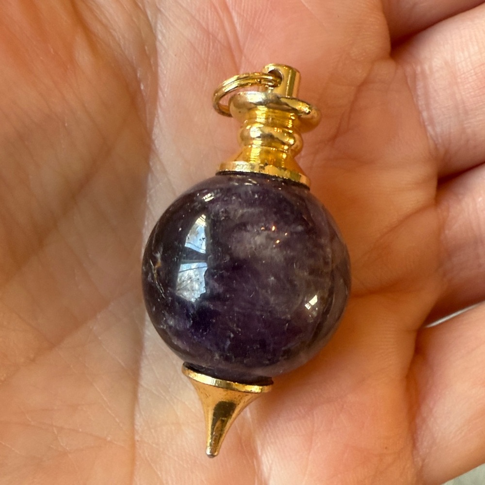 Amethyst pendulum used for energy healing, meditation and more